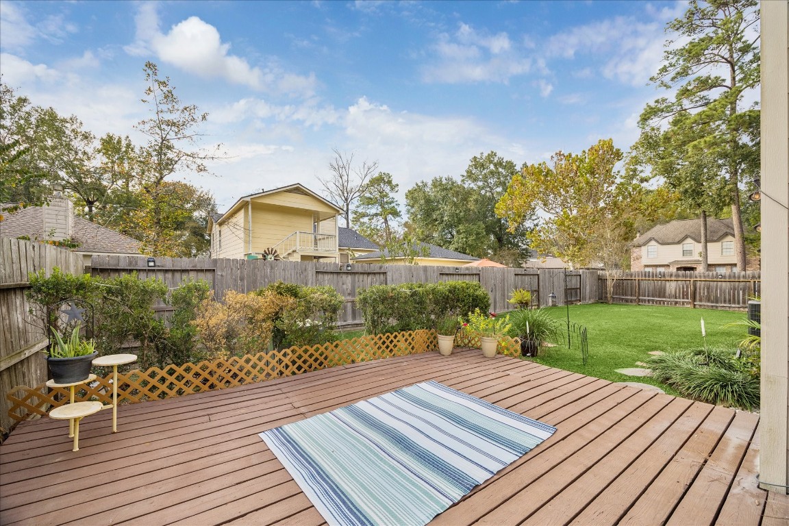 24919 Bovington Drive Spring, TX 77389 - Photo 19 of 21 An open deck greets you as you step outside from the living room.