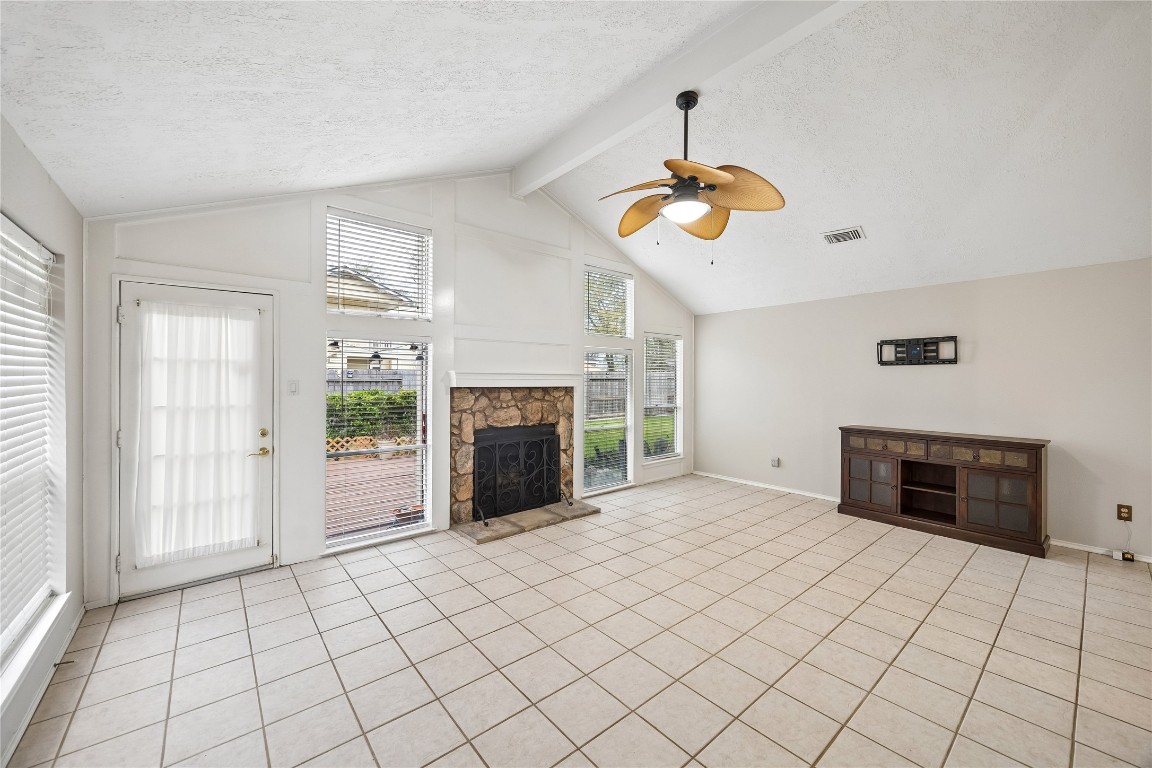 24919 Bovington Drive Spring, TX 77389 - Photo 3 of 21 Vaulted ceilings in the living room make this space feel expansive.