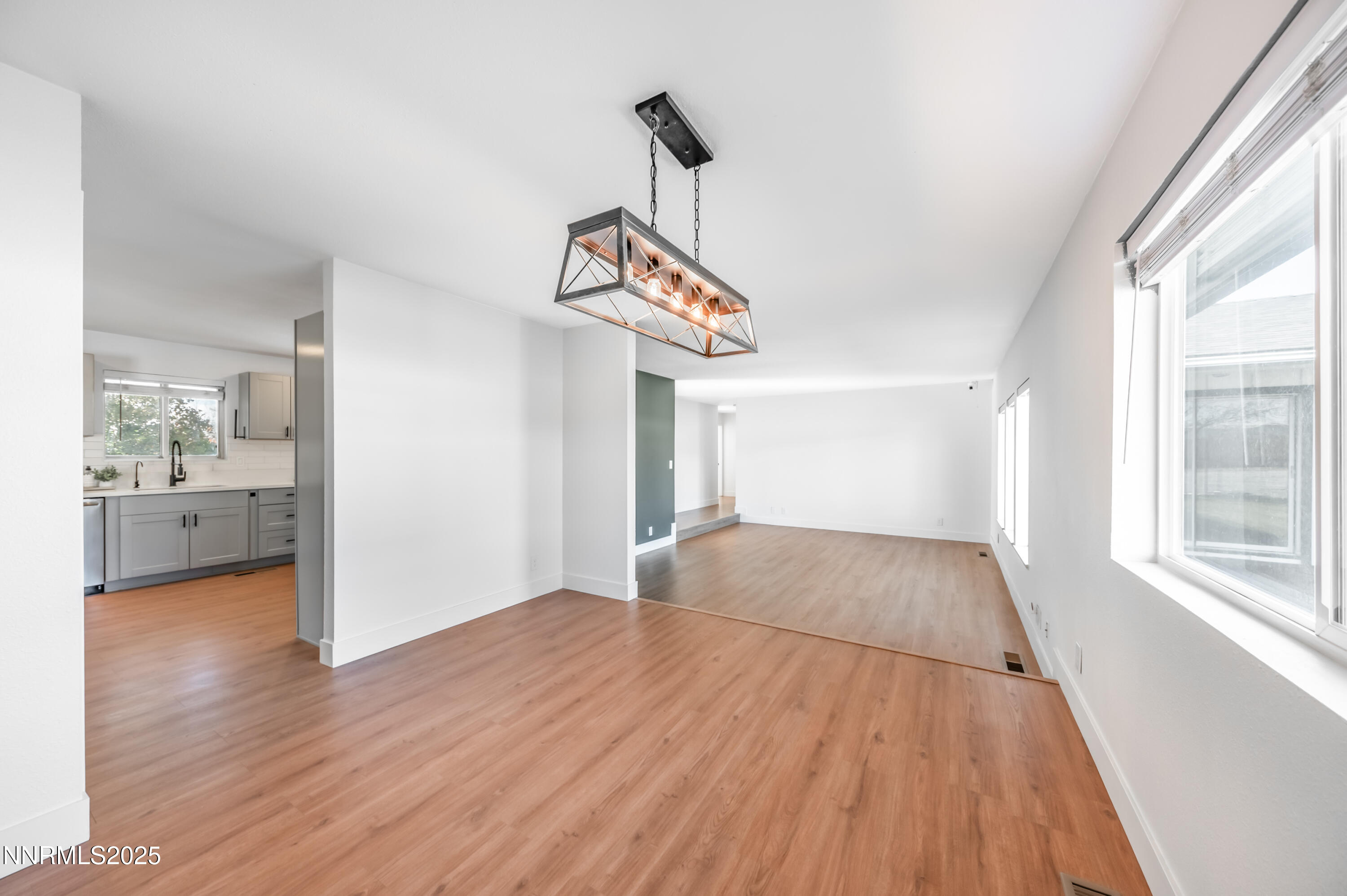 11675 Heartpine Street Reno, NV 89506 - Photo 12 of 38 a view of a room with wooden floor and windows