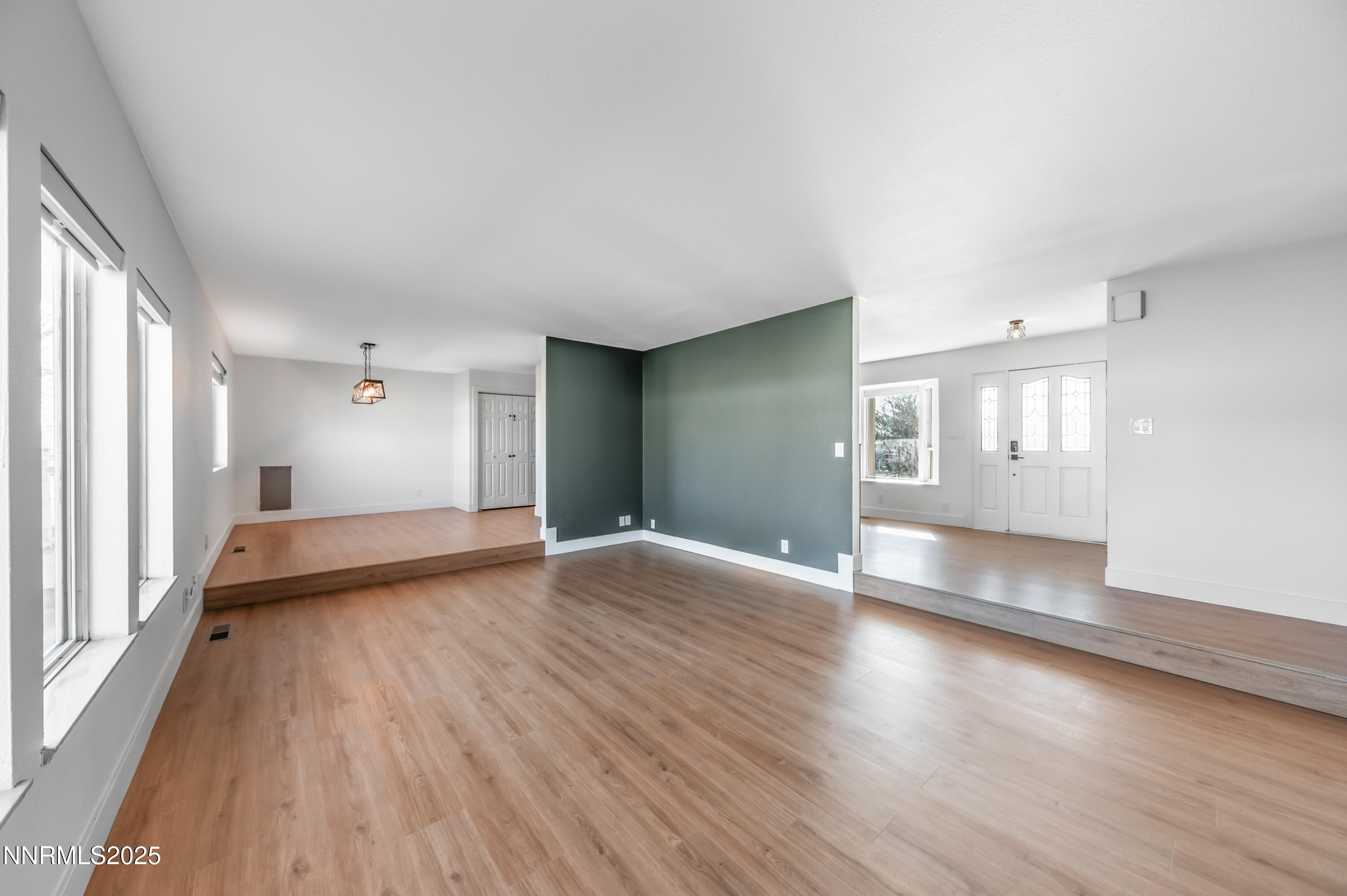 11675 Heartpine Street Reno, NV 89506 - Photo 13 of 38 an empty room with wooden floor and windows
