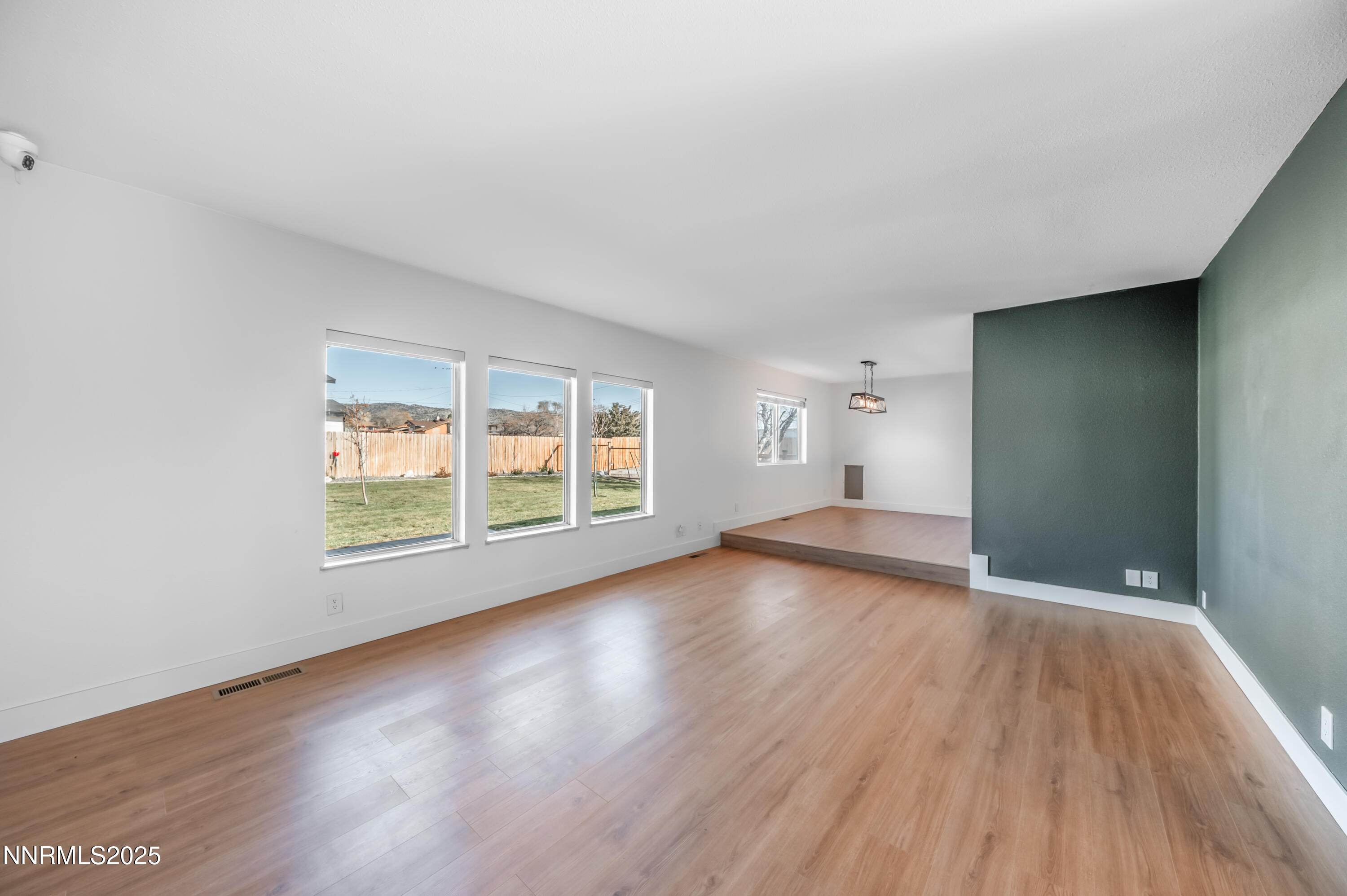 11675 Heartpine Street Reno, NV 89506 - Photo 14 of 38 a view of empty room with wooden floor and fan