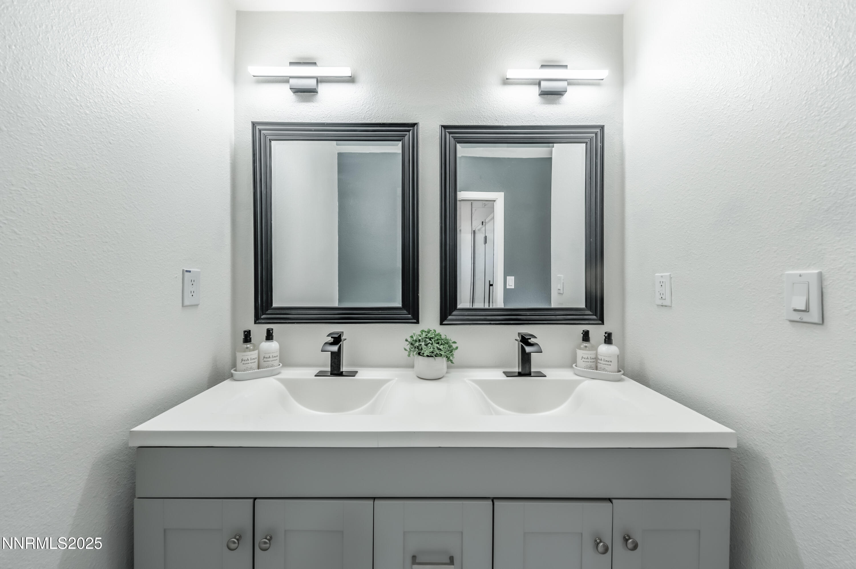 11675 Heartpine Street Reno, NV 89506 - Photo 18 of 38 a bathroom with double sink and two mirror