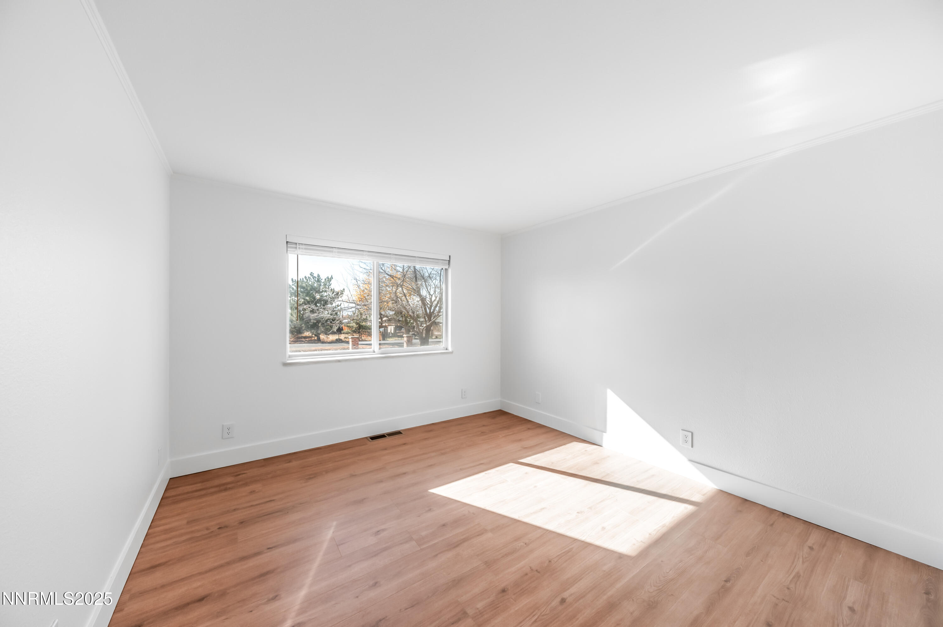 11675 Heartpine Street Reno, NV 89506 - Photo 20 of 38 an empty room with wooden floor and windows
