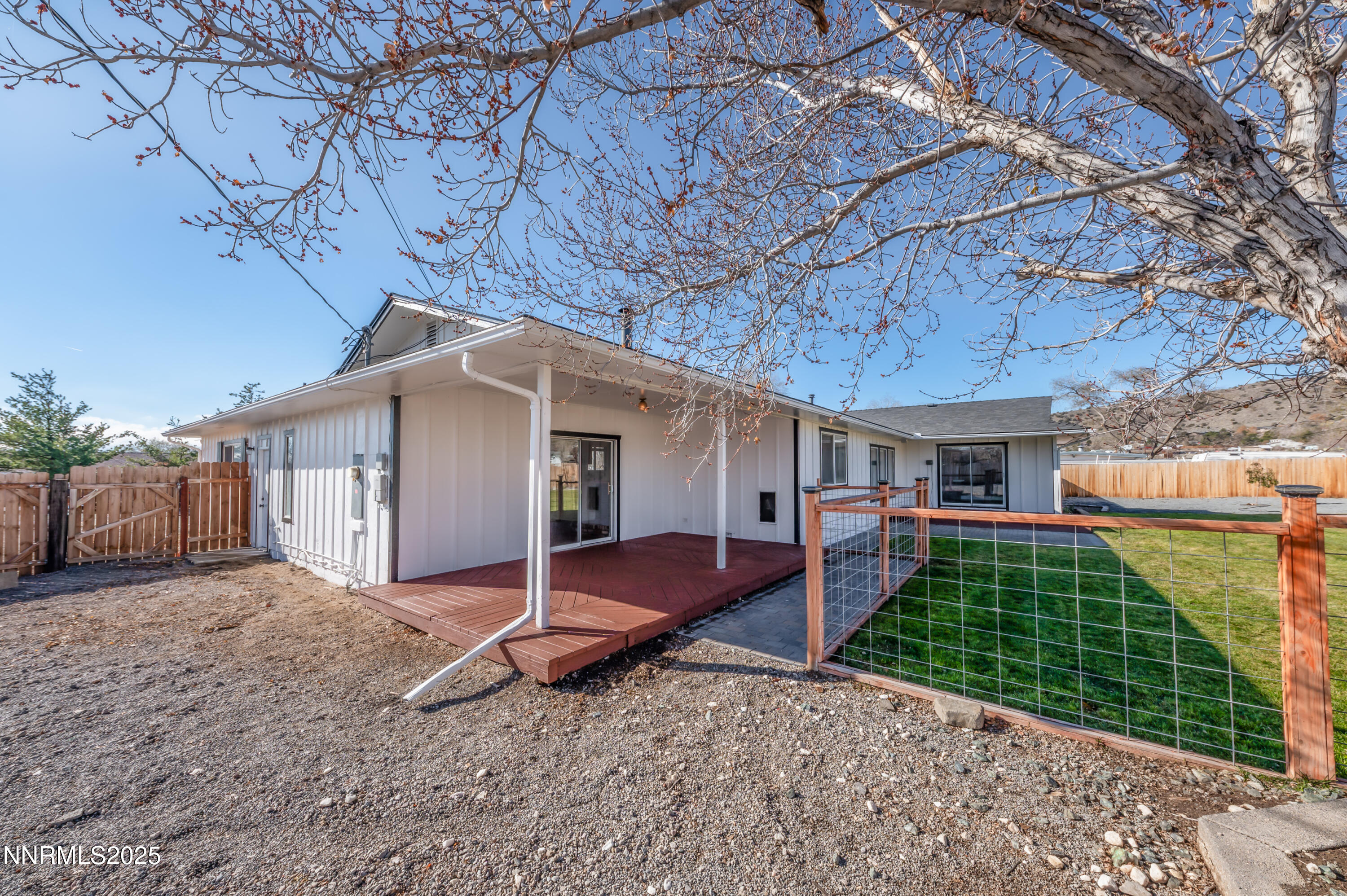 11675 Heartpine Street Reno, NV 89506 - Photo 23 of 38 a view of a house with a yard and garage
