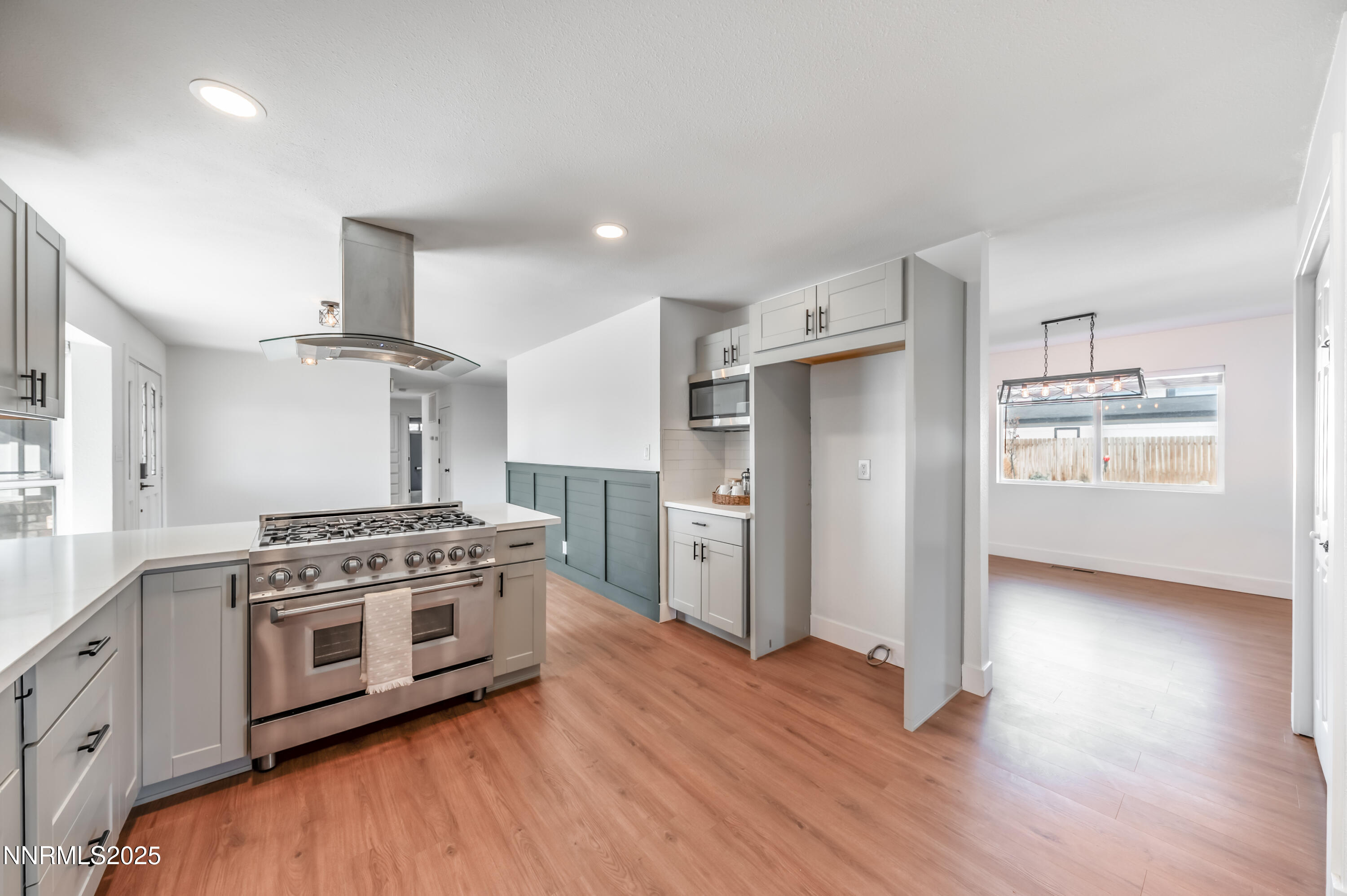11675 Heartpine Street Reno, NV 89506 - Photo 5 of 38 a kitchen with stainless steel appliances a stove top oven and a refrigerator