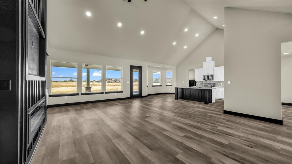 300 Jupiter Trail Weatherford, TX 76088 - Photo 11 of 33 a view of a kitchen with a sink and a stove top oven