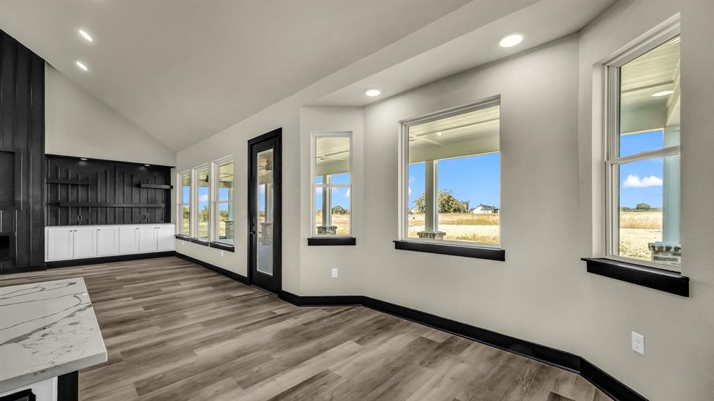 300 Jupiter Trail Weatherford, TX 76088 - Photo 15 of 33 a view of an entryway with wooden floor and windows