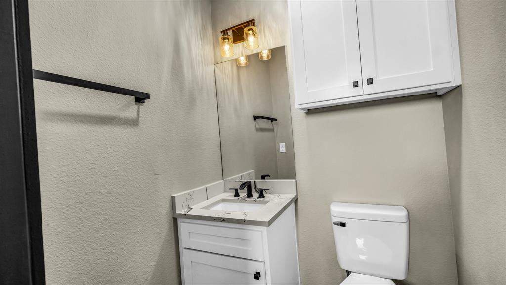 300 Jupiter Trail Weatherford, TX 76088 - Photo 17 of 33 a bathroom with a sink toilet and vanity