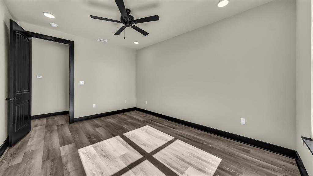 300 Jupiter Trail Weatherford, TX 76088 - Photo 20 of 33 a view of an empty room and wooden floor