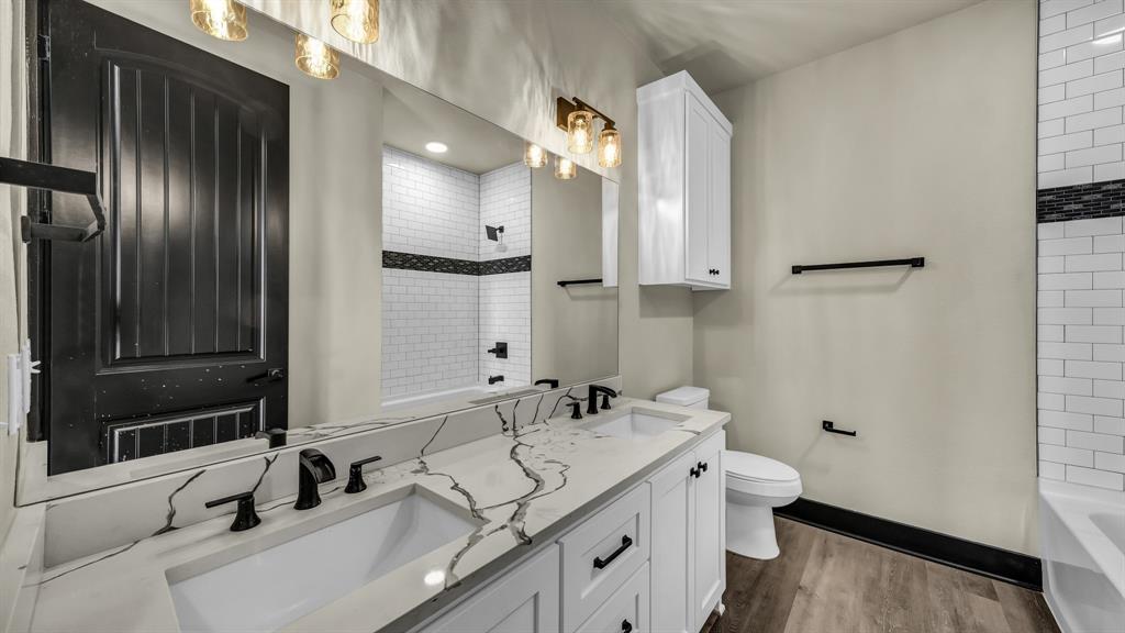 300 Jupiter Trail Weatherford, TX 76088 - Photo 25 of 33 a bathroom with a sink and a mirror