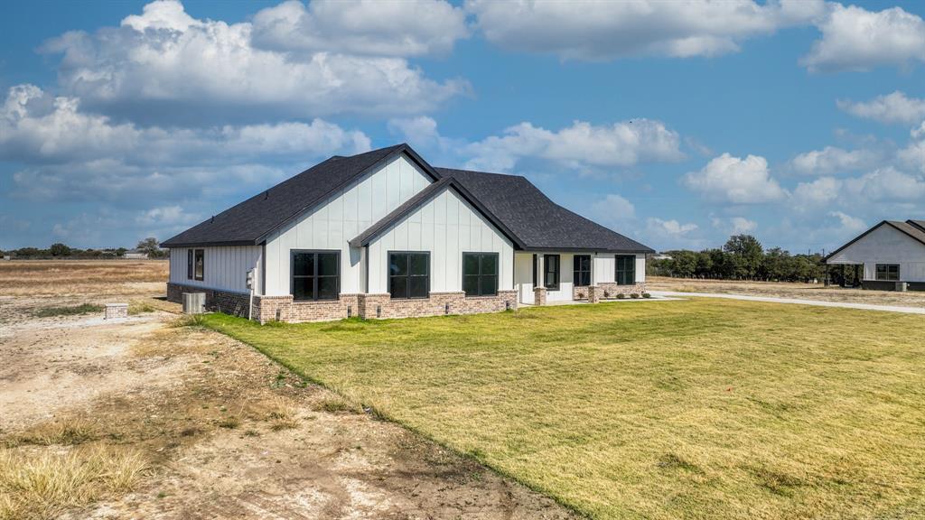 300 Jupiter Trail Weatherford, TX 76088 - Photo 33 of 33 a front view of a house with swimming pool having outdoor seating
