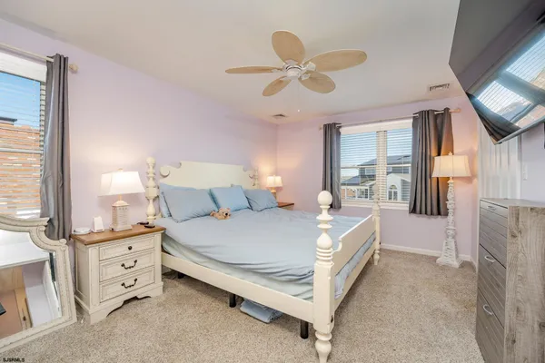 a bed room with a bed and a chandelier