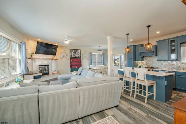 a living room with fireplace furniture and a flat screen tv