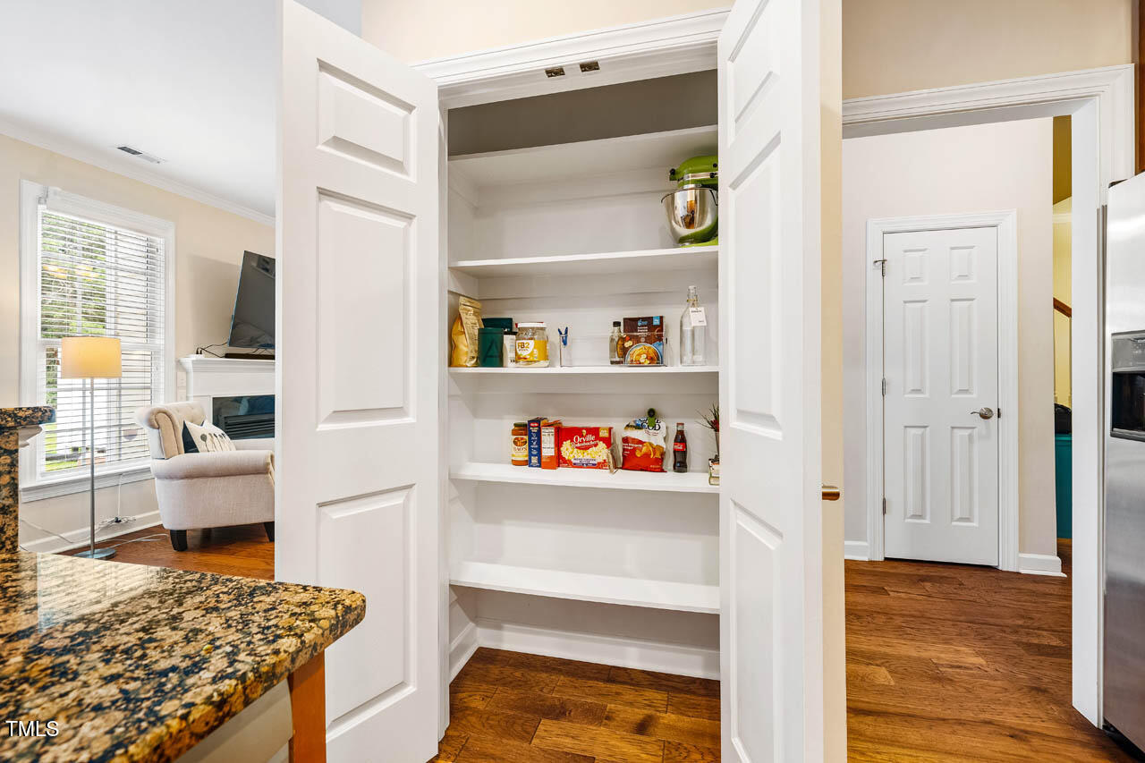 5515 South Roxboro Street, Unit 4 Durham, NC 27713 - Photo 11 of 34 a view of kitchen and utility room with wooden floor