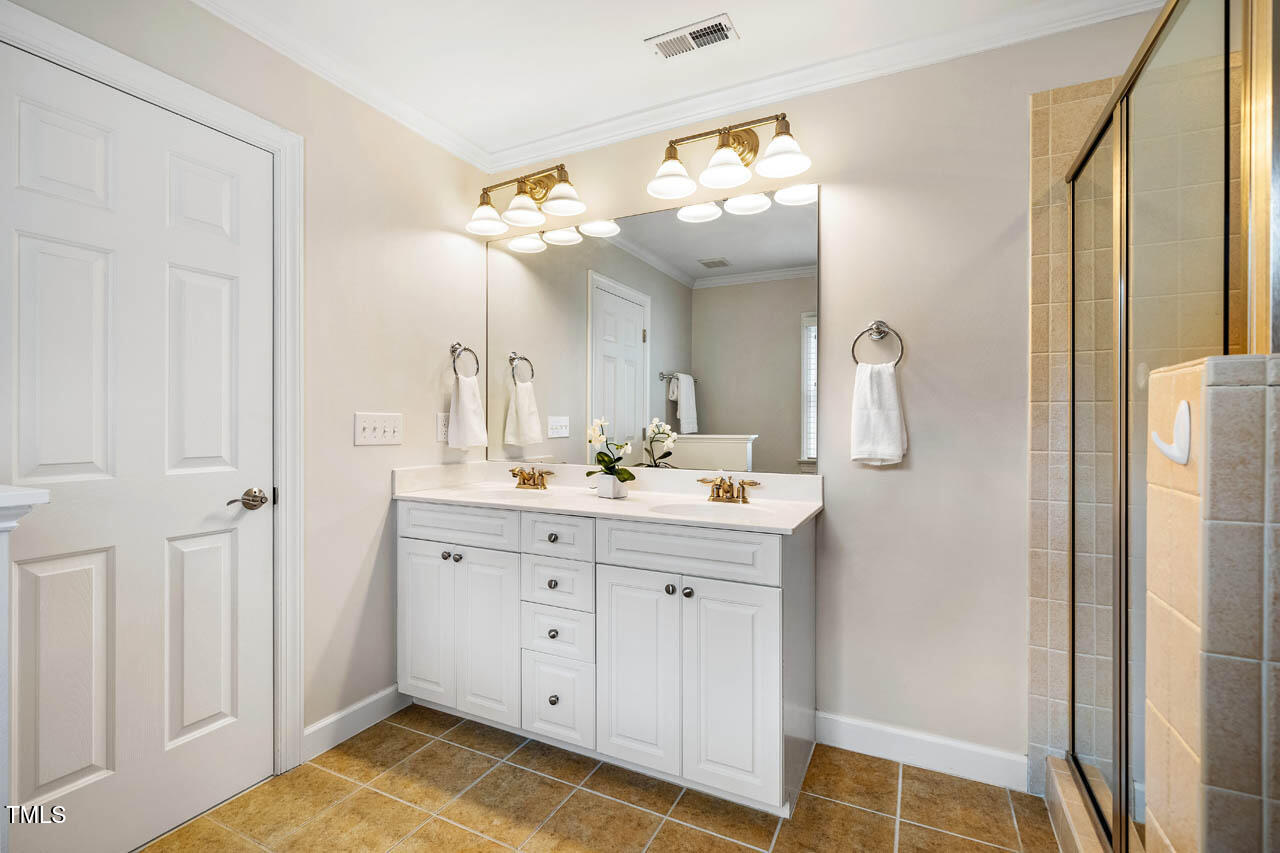 5515 South Roxboro Street, Unit 4 Durham, NC 27713 - Photo 20 of 34 a bathroom with a sink vanity and a mirror