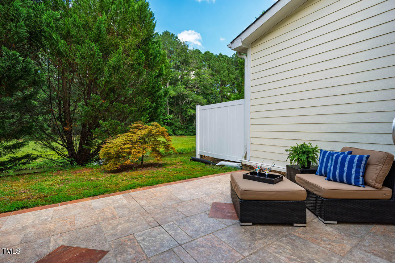 5515 South Roxboro Street, Unit 4 Durham, NC 27713 - Photo 31 of 34 a view of a patio with couches chairs and a fire pit