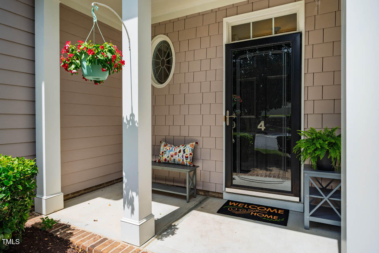 5515 South Roxboro Street, Unit 4 Durham, NC 27713 - Photo 3 of 34 a potted plant sitting in front of a door