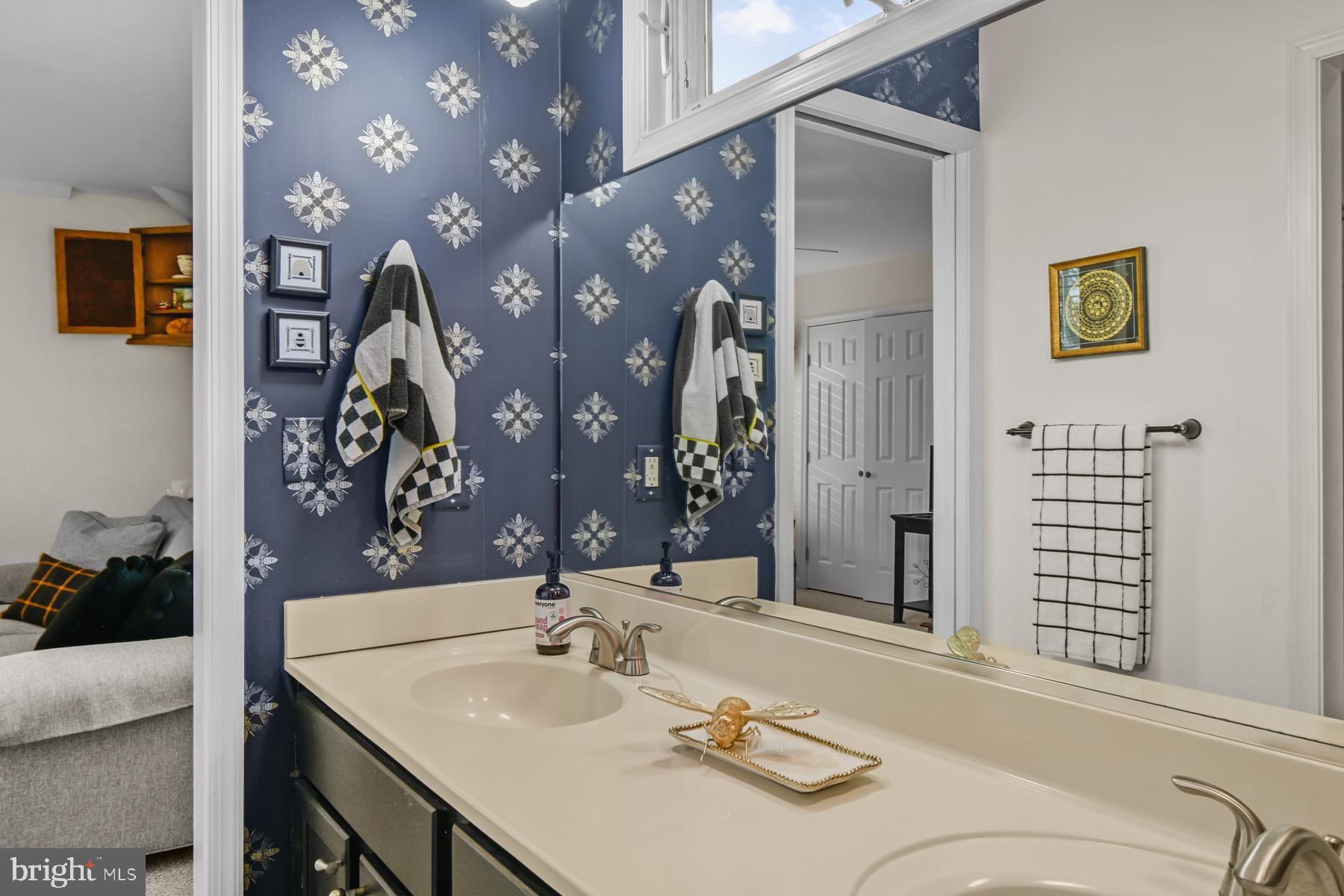 103 Buckingham Road Berlin, MD 21811 - Photo 42 of 62 a bathroom with a sink vanity and a mirror