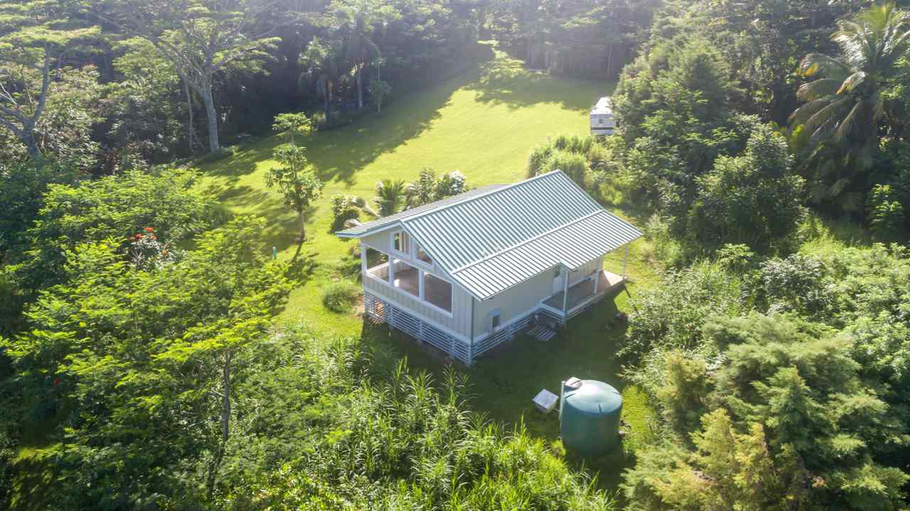 250 Waiohonu Road Haiku, HI 96708 - Photo 22 of 23 a view of a house with a yard and garden