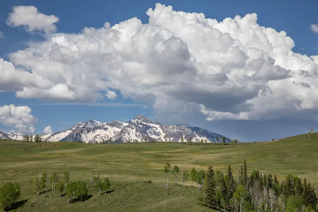 a view of an ocean with mountain