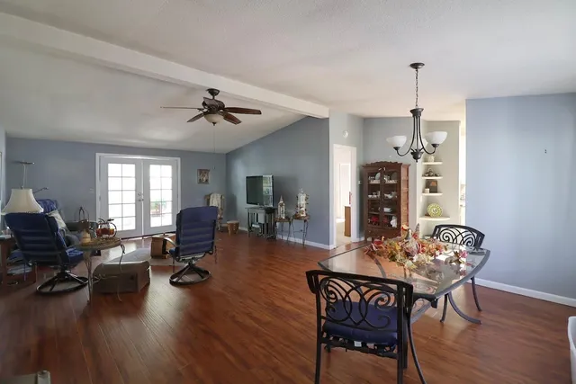 a living room with fireplace furniture and a wooden floor