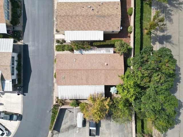 an aerial view of a house with a yard and garden