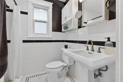 a view of a livingroom with furniture wooden floor and window