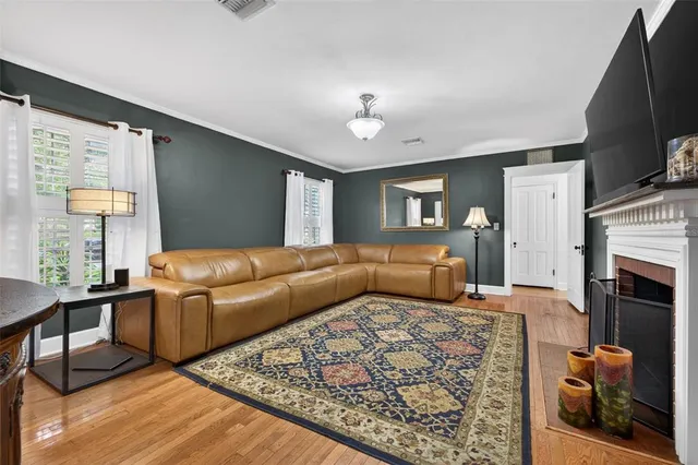 a bedroom with furniture and a fireplace