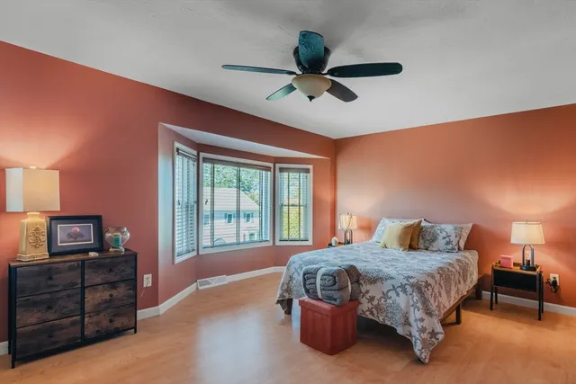 a bedroom with a bed and a tv