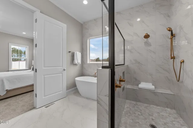 an empty room with a window and ceiling fan