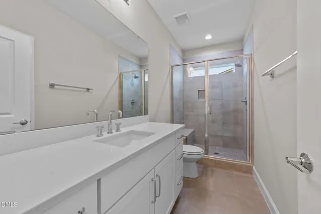 an aerial view of a house with outdoor space and lake view