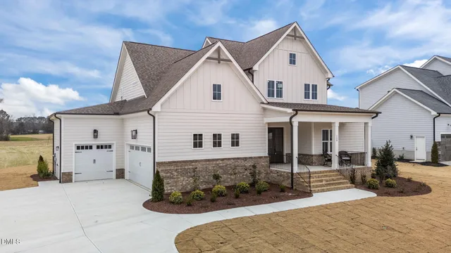 a kitchen with a stove and wooden floor