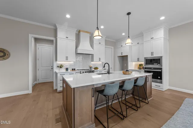 a view of kitchen with stainless steel appliances granite countertop cabinets and outdoor living room