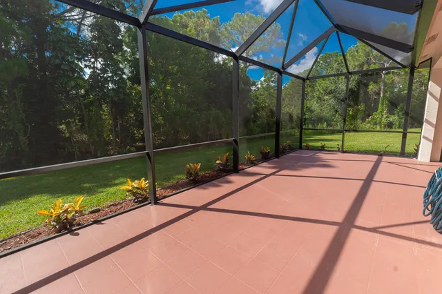 a view of a balcony with a small yard