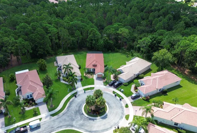 an aerial view of house with yard swimming pool and outdoor seating