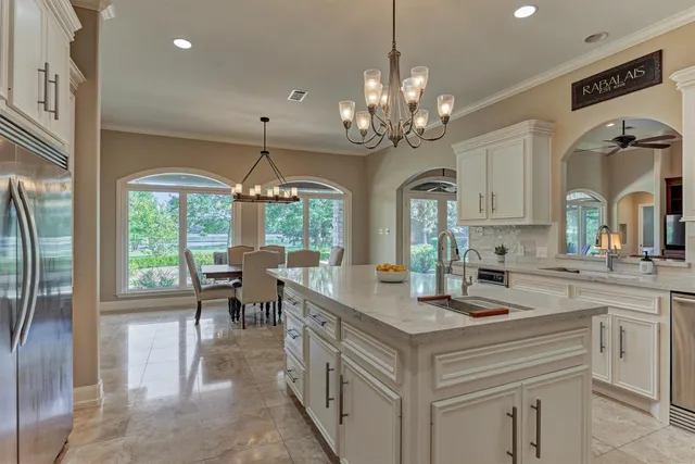 a view of a kitchen with granite countertop stainless steel appliances lots of counter top space