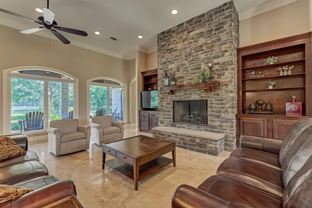 a living room with furniture and a fireplace