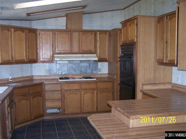 17255 Waxwing Street Reno, NV 89508 - Photo 2 of 13 a kitchen with a sink and cabinets