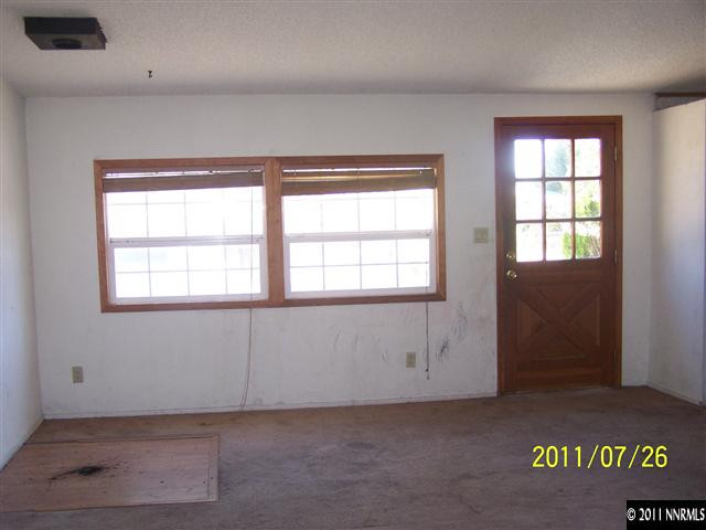 17255 Waxwing Street Reno, NV 89508 - Photo 3 of 13 an empty room with windows