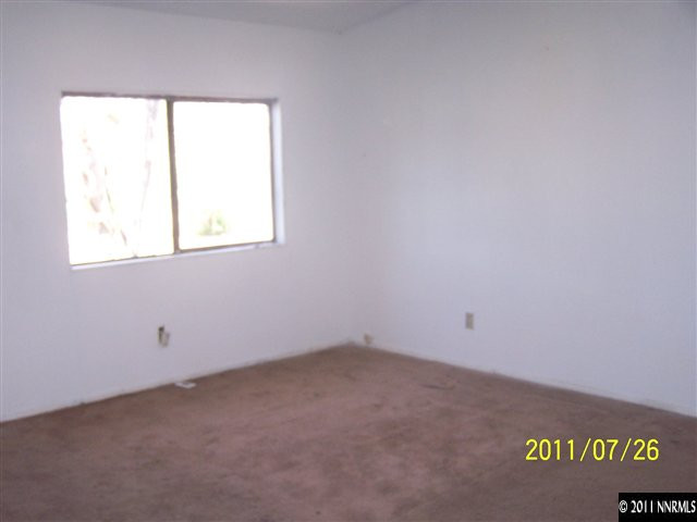17255 Waxwing Street Reno, NV 89508 - Photo 4 of 13 an empty room with a window