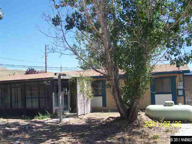 17255 Waxwing Street Reno, NV 89508 - Photo 10 of 13 a patio with a table and chairs and potted plants