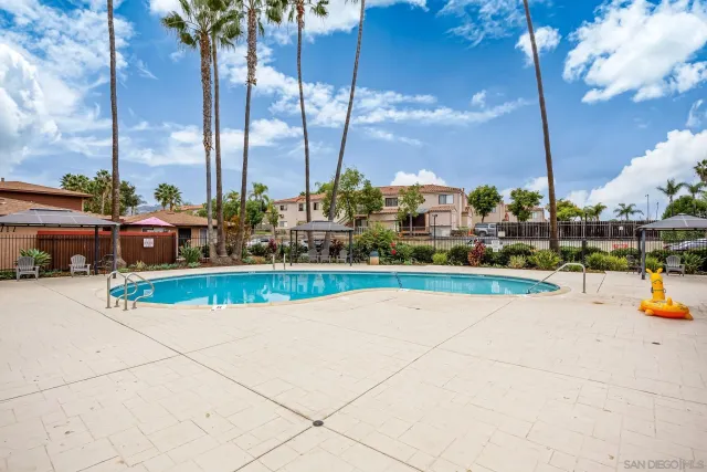 a view of swimming pool with outdoor seating