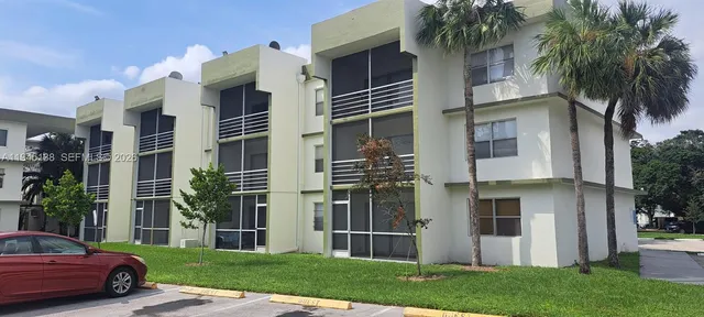 a view of the street and parked cars