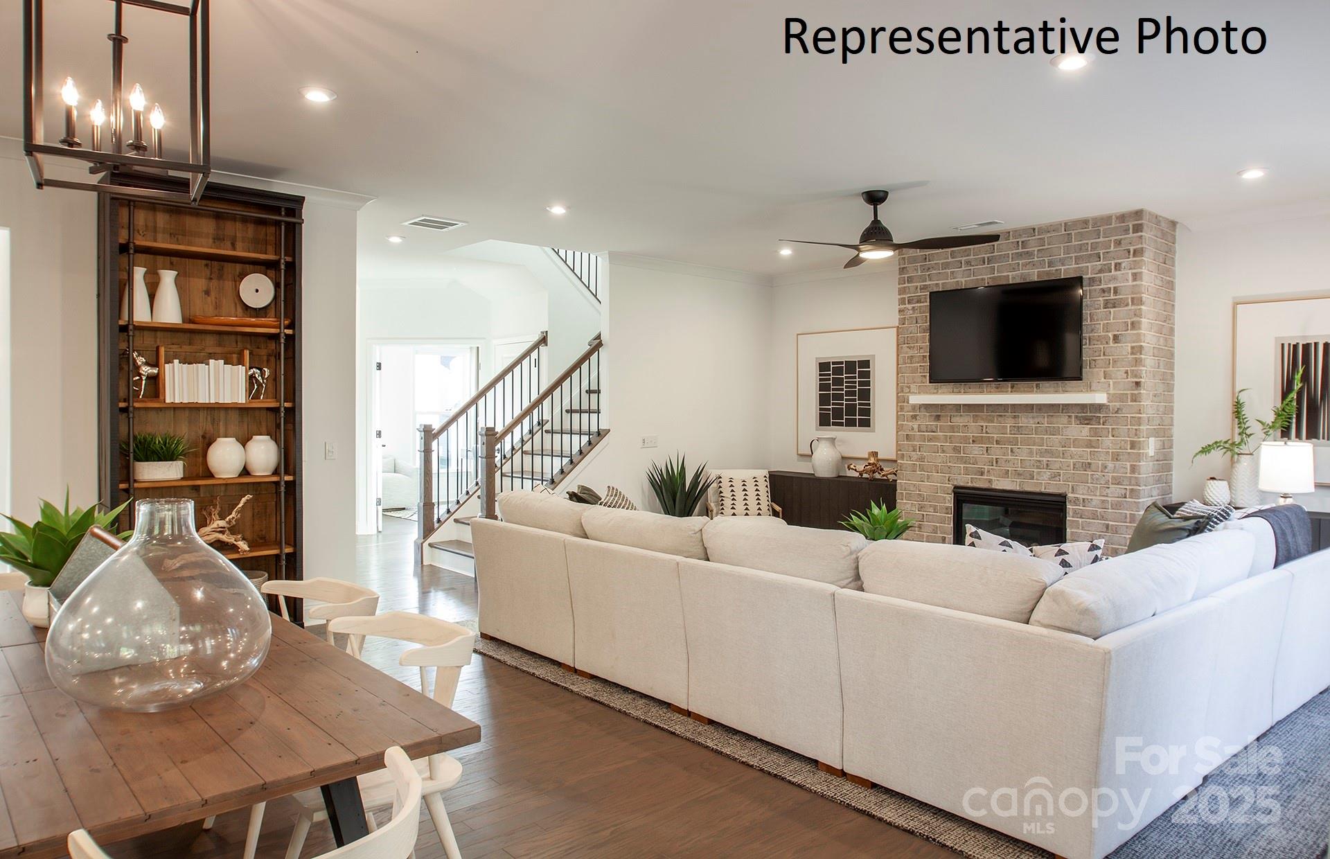 4707 Formation Court, Unit 49 Lancaster, SC 29720 - Photo 11 of 21 a living room with furniture a flat screen tv and a fireplace