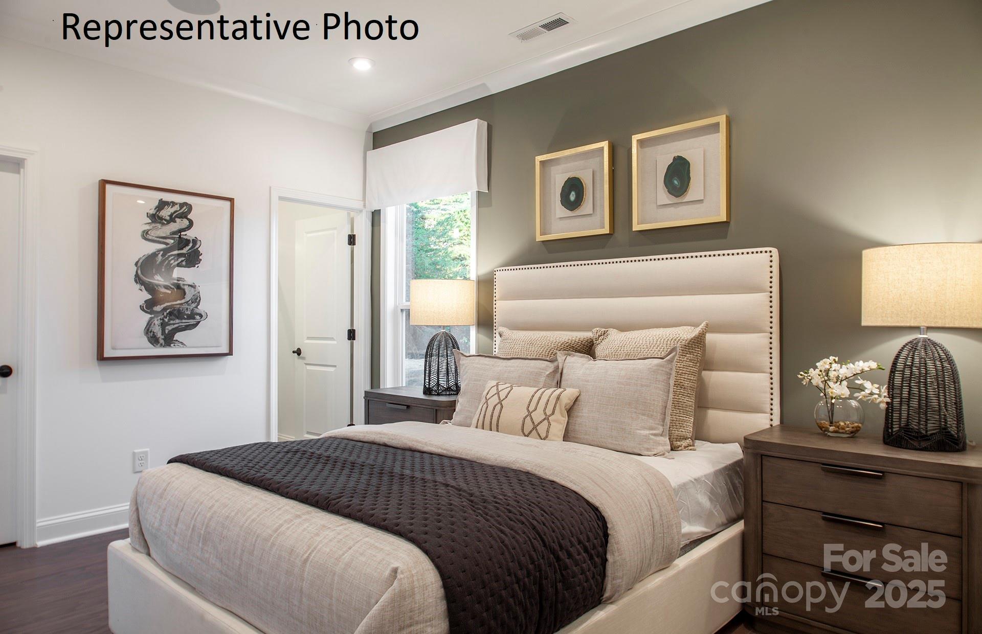 4707 Formation Court, Unit 49 Lancaster, SC 29720 - Photo 14 of 21 a bedroom with a bed and painting on the wall