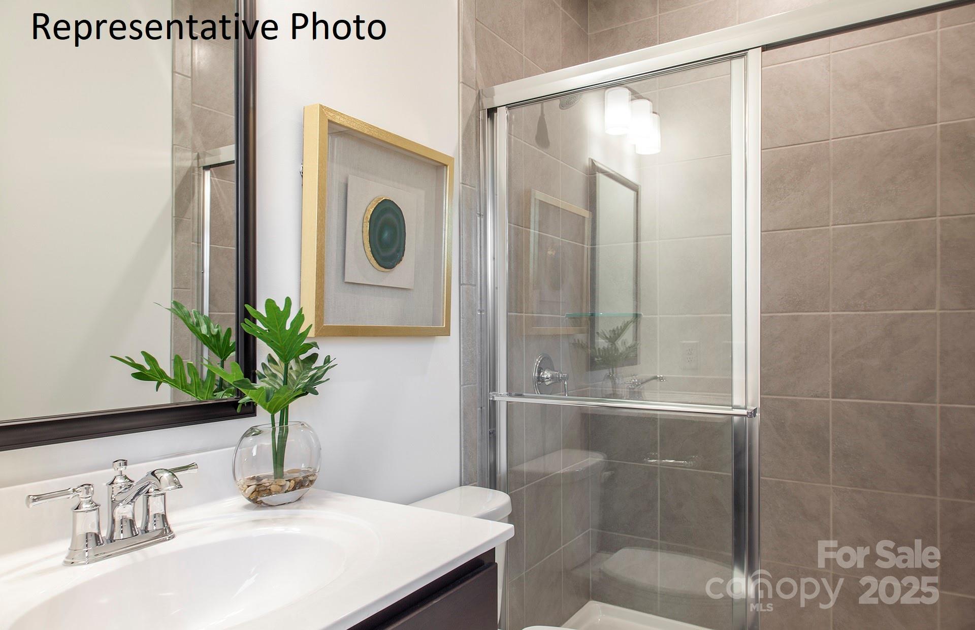 4707 Formation Court, Unit 49 Lancaster, SC 29720 - Photo 15 of 21 a bathroom with a shower a mirror and a sink