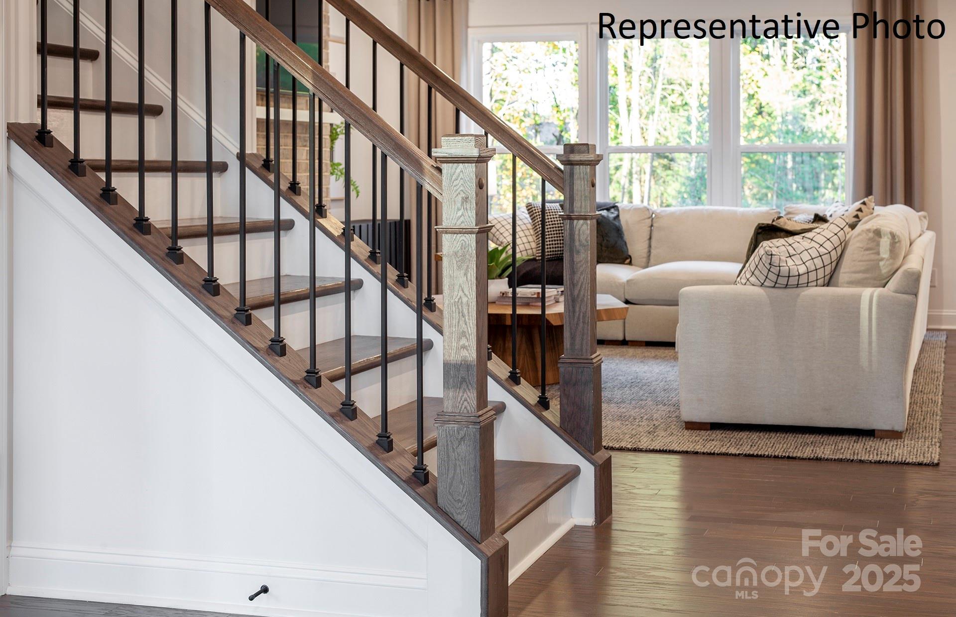 4707 Formation Court, Unit 49 Lancaster, SC 29720 - Photo 2 of 21 a living room with furniture and stairs