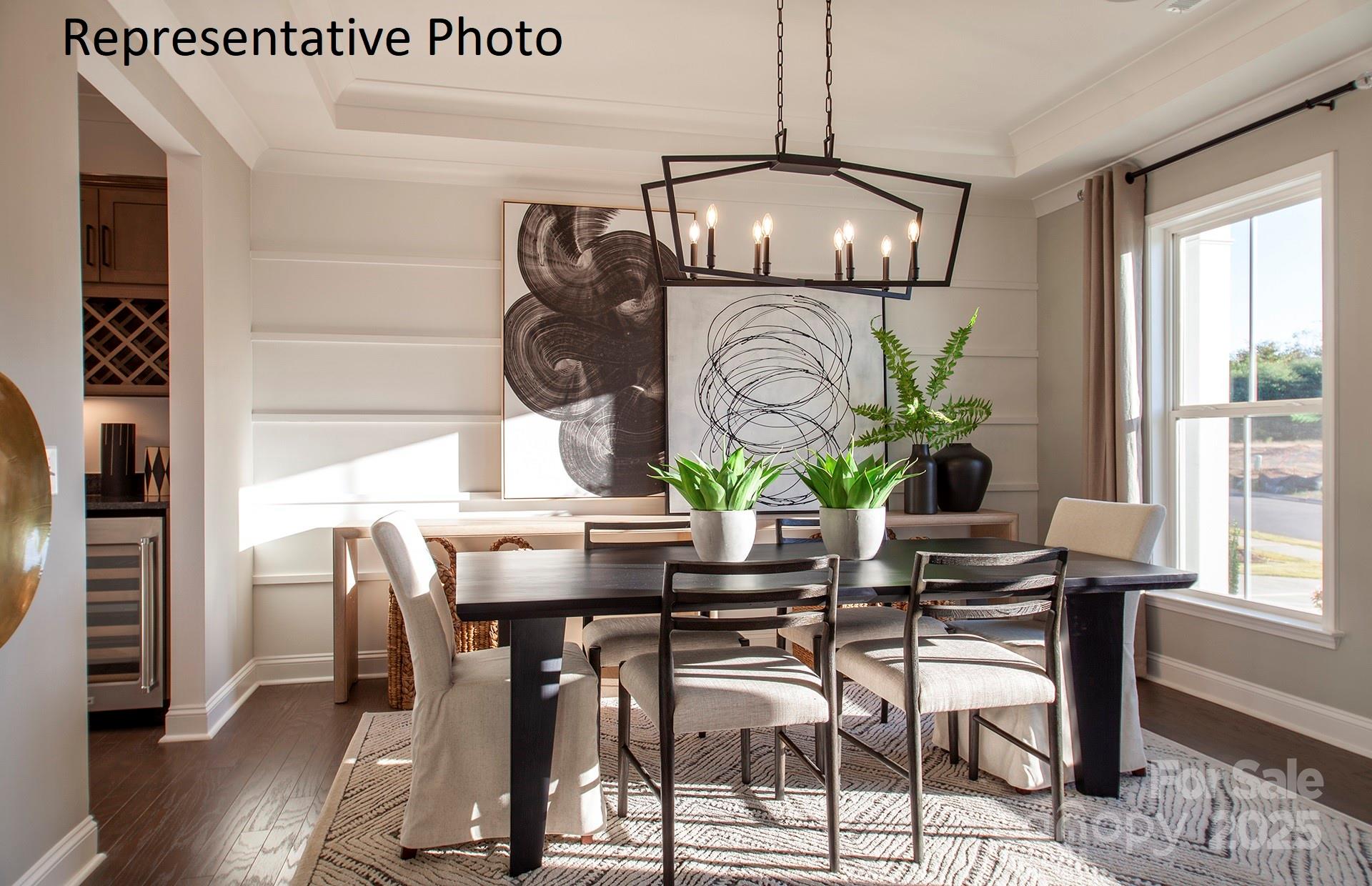 4707 Formation Court, Unit 49 Lancaster, SC 29720 - Photo 6 of 21 a view of a dining room with furniture window and wooden floor
