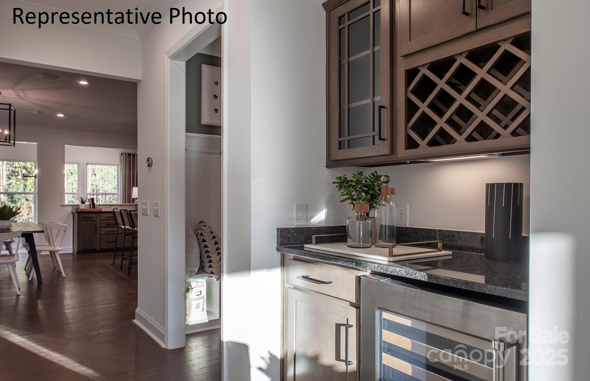 4707 Formation Court, Unit 49 Lancaster, SC 29720 - Photo 7 of 21 a kitchen with stainless steel appliances granite countertop a sink a stove and a wooden floors