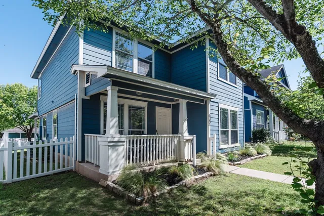 front view of a house with a small yard
